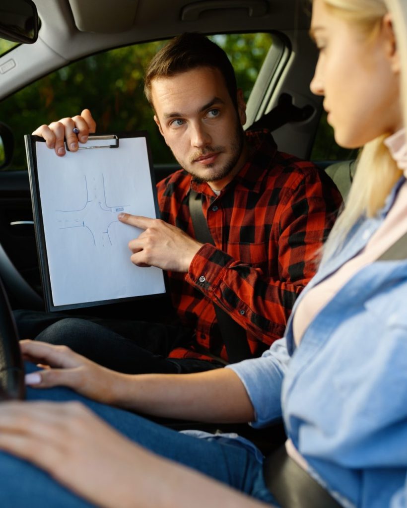 woman-and-man-with-checklist-driving-school-1-e1627375367962.jpg